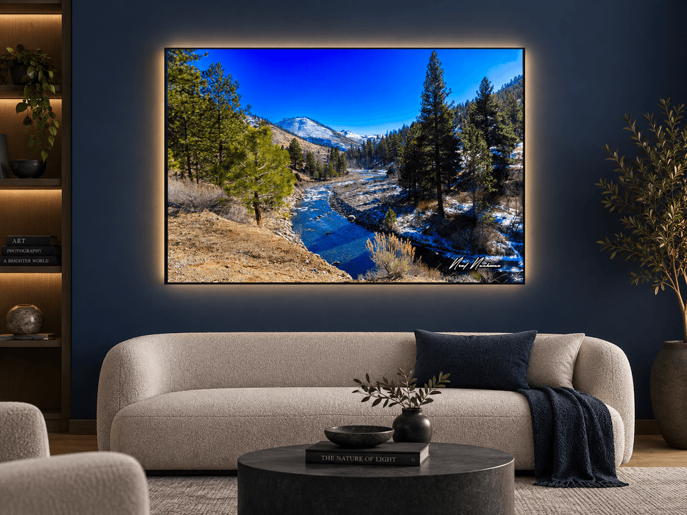 Alpine Serenity landscape photograph displayed as Luchae illuminated fine art, featuring a blue mountain river, pine trees and snow-covered mountains.