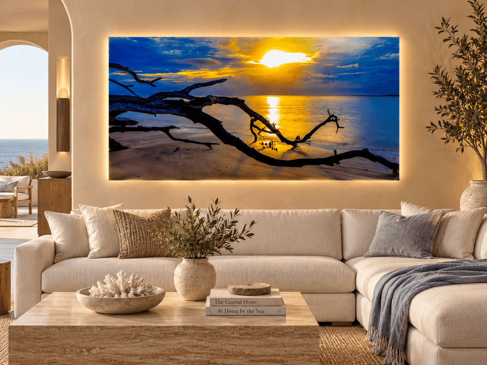 Golden Driftwood coastal sunset photograph displayed as Luchae illuminated fine art, featuring silhouetted driftwood, golden sunlight and ocean reflections.