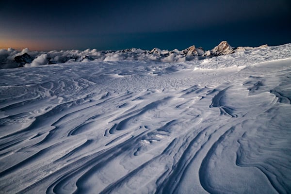 Sculpted snow and jaw dropping views. At over 21,000 feet this was the highest bivy any of us had slept. A migical experience.
