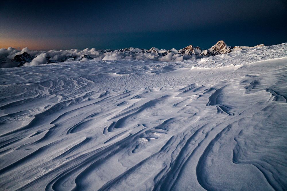 Sculpted snow and jaw dropping views. At over 21,000 feet this was the highest bivy any of us had slept. A migical experience.