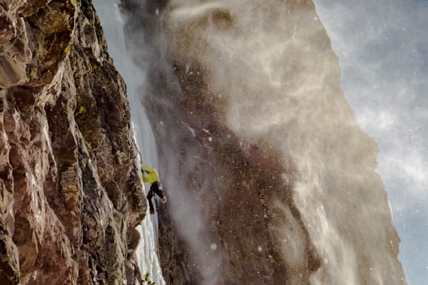 Noah Ronczkowski climbing "Responsible Family Men" 60M WI5 on a blustery January day. Hyalite Canyon Montana