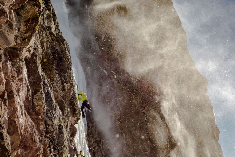 Noah Ronczkowski climbing "Responsible Family Men" 60M WI5 on a blustery January day. Hyalite Canyon Montana