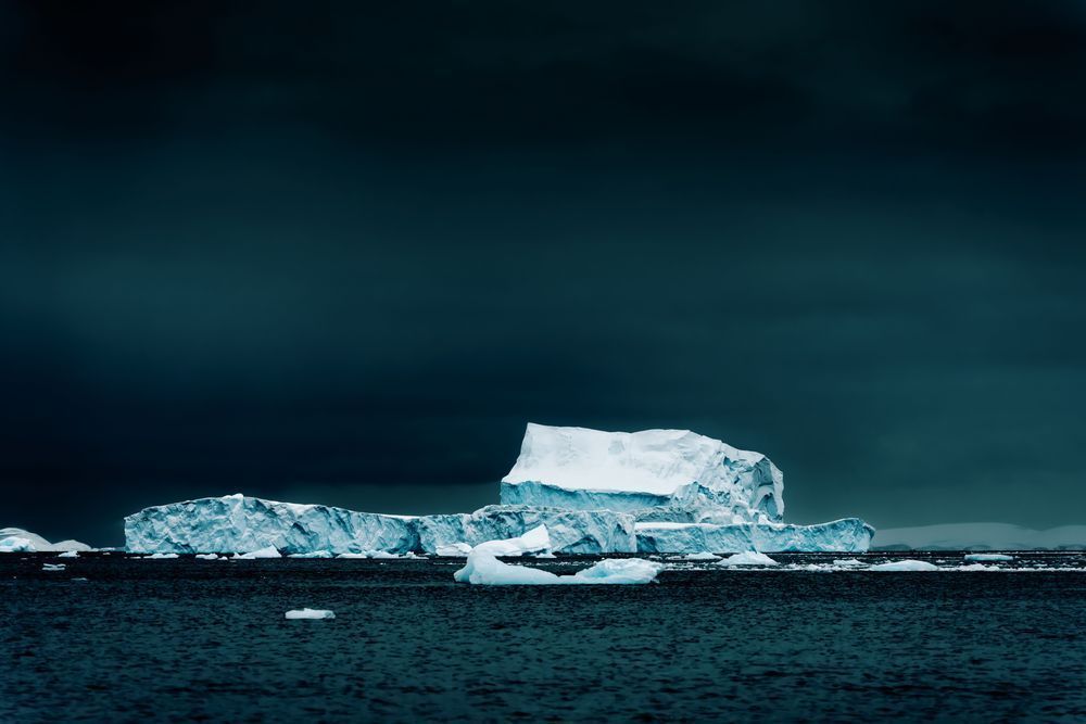 Antarctic Icebergs Under Stormy Sky | Polar Seascape Photography
