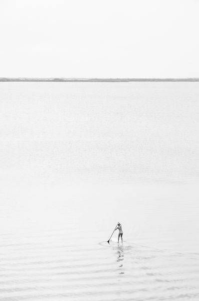 Lone Paddleboarder Black and White Photography Print | Minimalist Coastal Wall Art