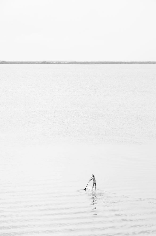 Lone Paddleboarder Black and White Photography Print | Minimalist Coastal Wall Art