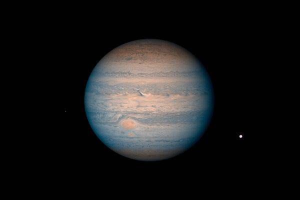 Jupiter & Moons — Hubble False‑Color Astrophotograph