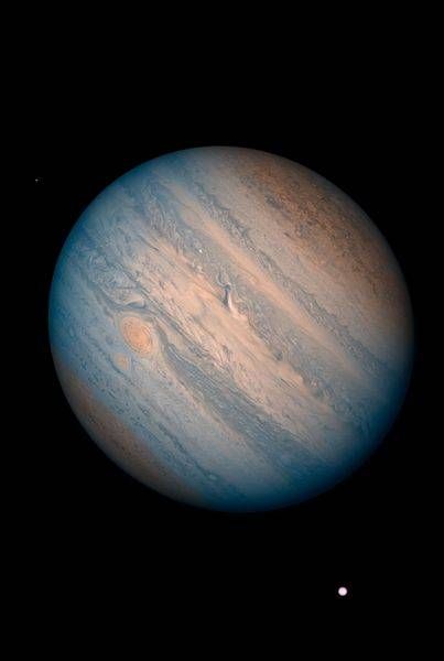Jupiter Stormscape with Io & Metis (Hubble IR/UV Composite)