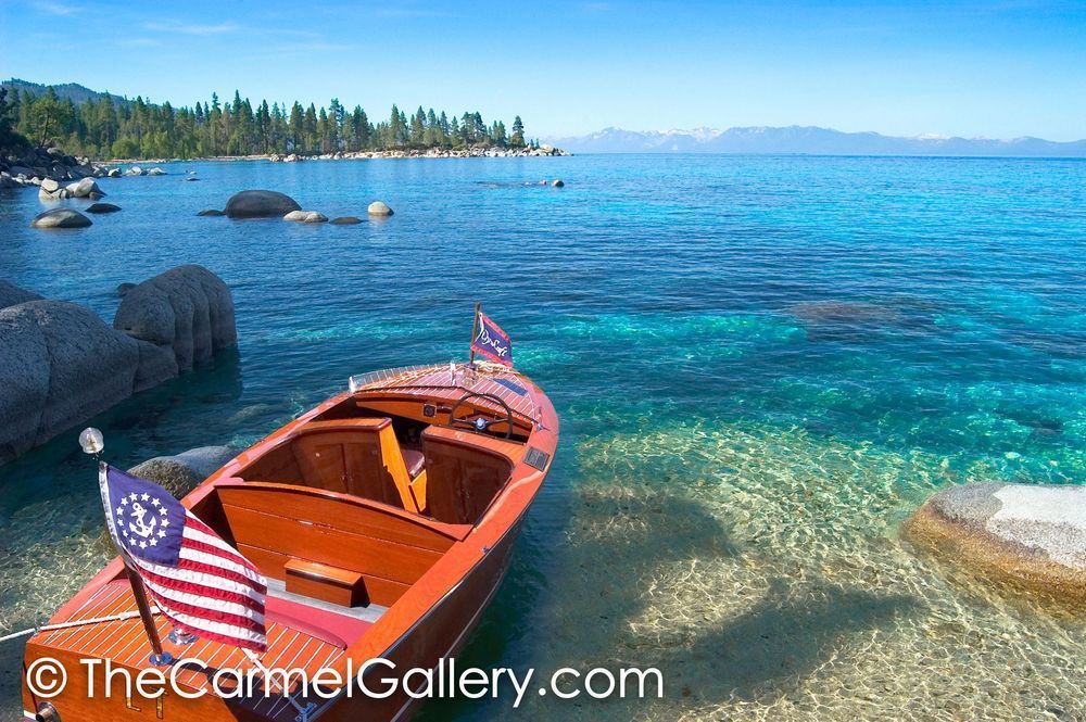 Old wooden boat with american flag at Lake Tahoe
