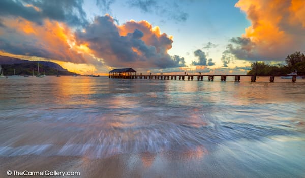 photo of sunset over Hanalei Pier
