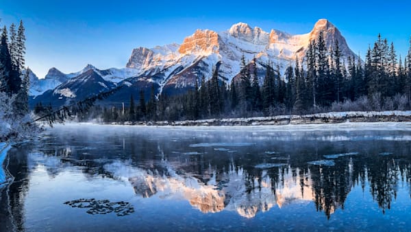 Golden Light Over Icy Waters – Majestic Mountainscape