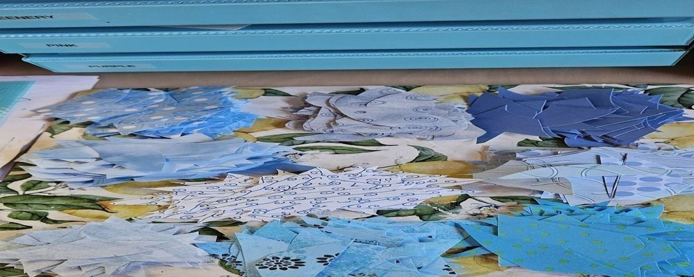 
        <div class='title'>
          Sorted collage paper pieces in various blue tones organized by color
        </div>
       
        <div class='description'>
          
        </div>
      