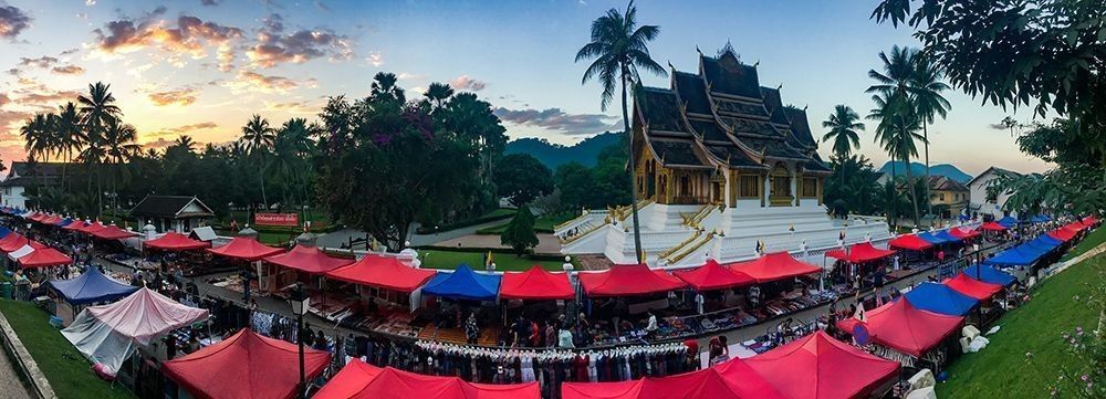 The night market in Luang Prabang, Laos, set beneath the temples at dusk