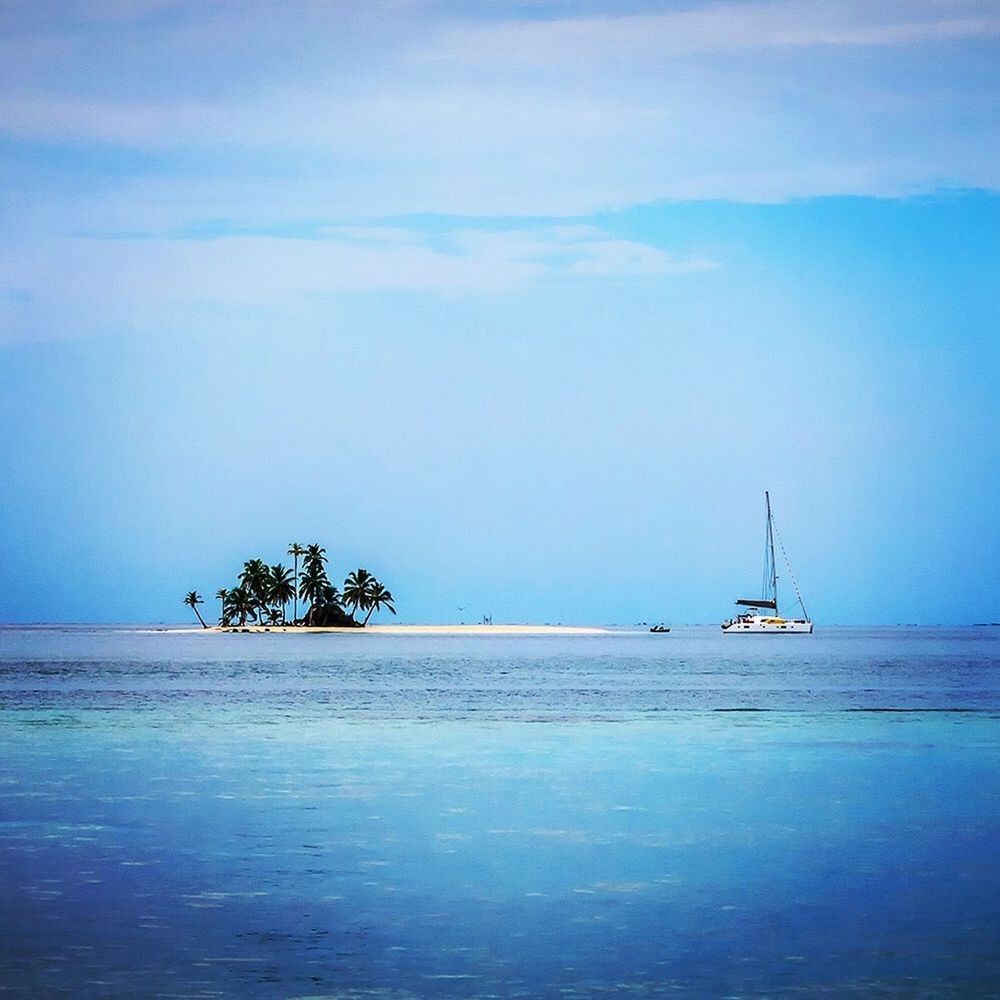 Sailboat anchored to tiny Caribbean Island