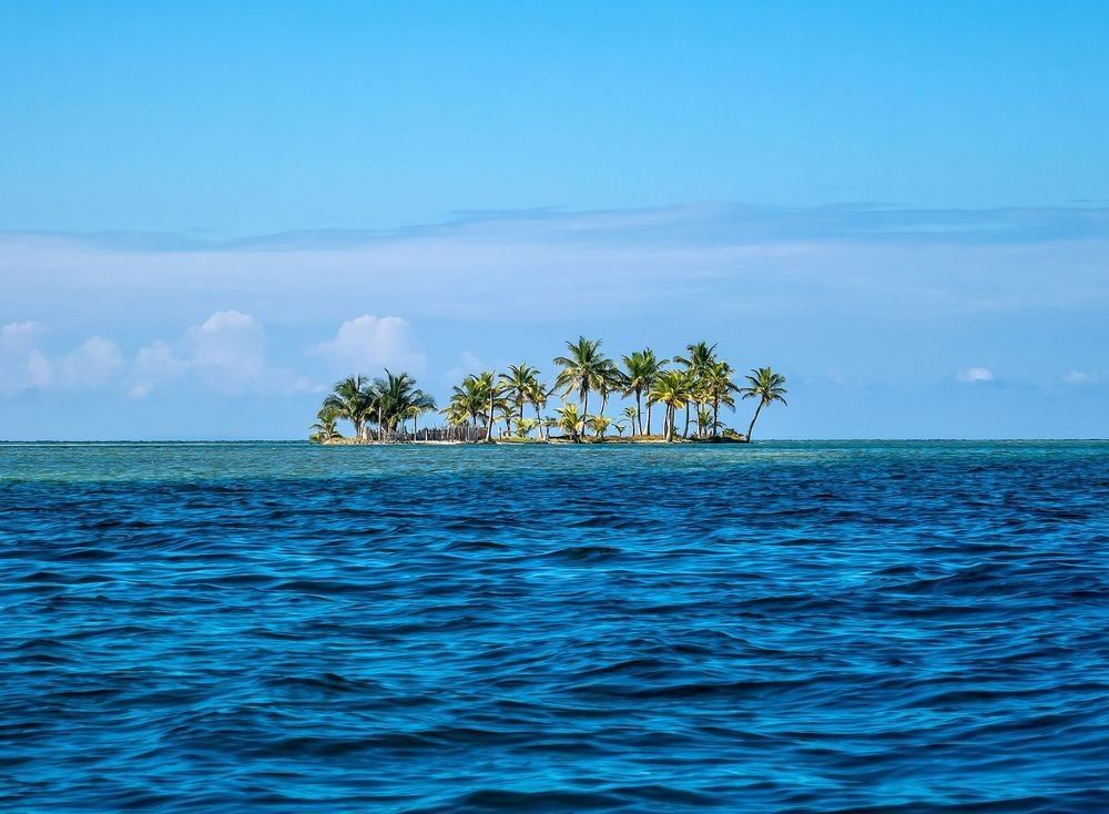 A long tiny island with palm trees in San Blas, Panama
