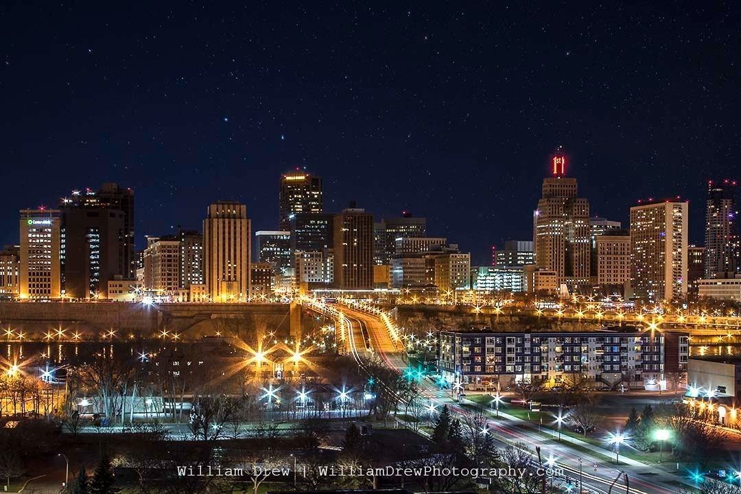 Kidd Park View of the St. Paul Minnesota Skyline at Night with the Wabash Street Bridge in the foreground crossing the Mississippi River by William Drew Photography