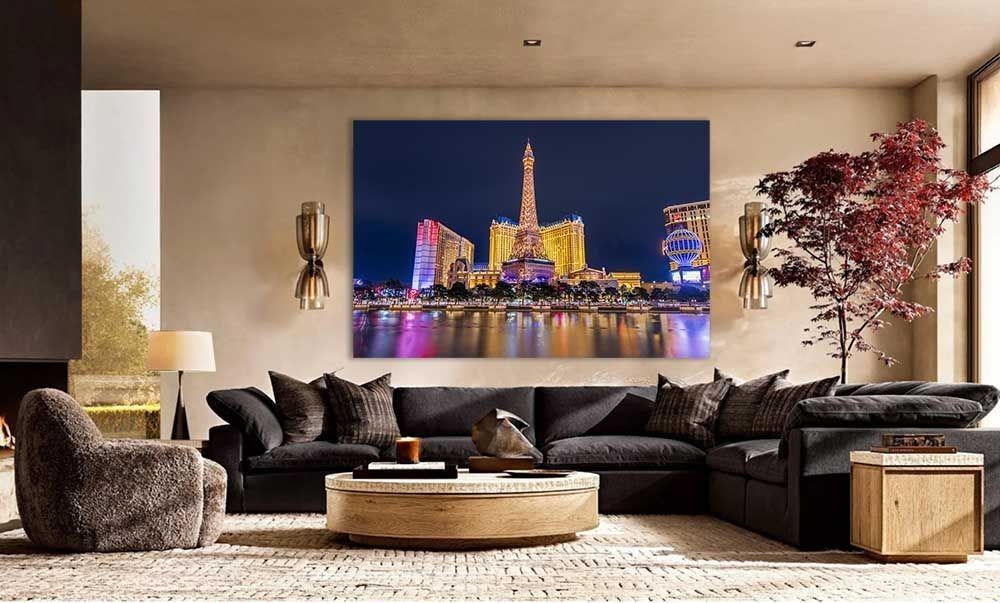 A nighttime print of the Paris Resort in Las Vegas on a living room wall