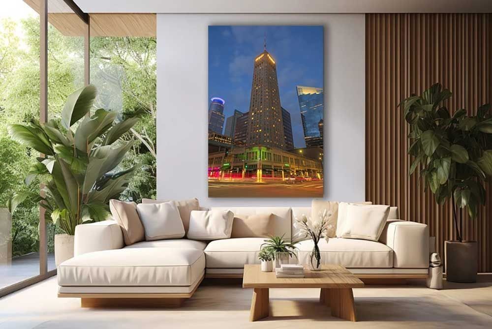 The historic Foshay Tower glows at blue hour in downtown Minneapolis - fine art print in a living room above a sofa.