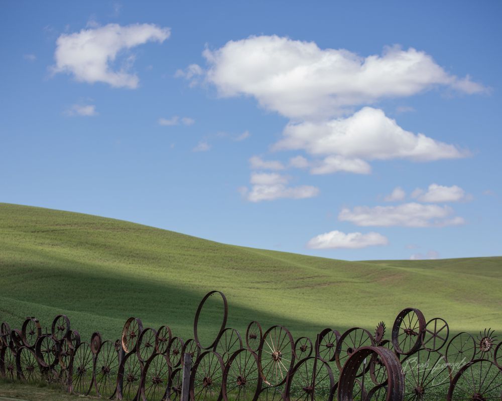 Wheel Fence and Clouds Photo for Sale by Barb Gonzalez Photography