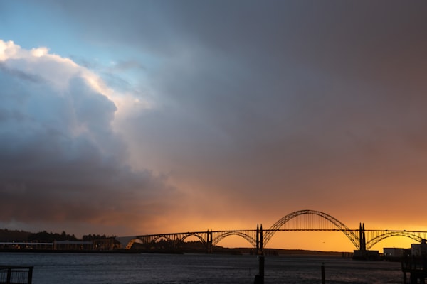 Stunning stormy sunset at Yaquina Bay Bridge photo by Barb Gonzalez Photography