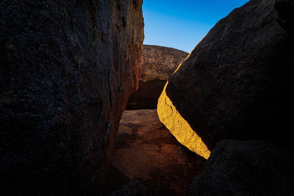 A Sliver Of Light Illuminates Boulder Photography Art | John Lazo Photography
