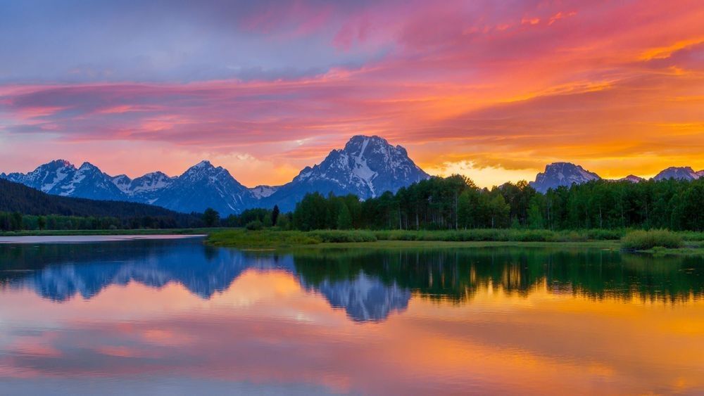Oxbow Bend sunset reflections in Grand Teton National Park photographed by Robbie George