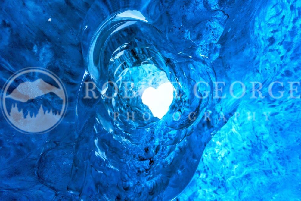 Imperfectly Perfect - Heart Shaped Ice Cave in Iceland by Robbie George Photography