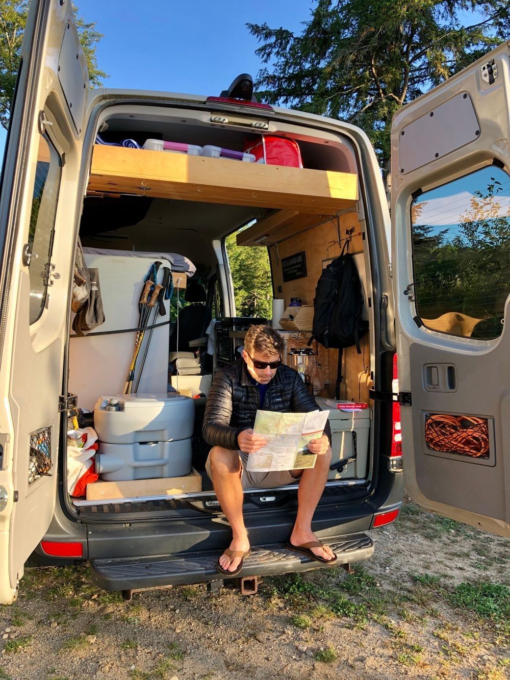 Robbie George in the field studying maps and preparing for wildlife photography and observation
