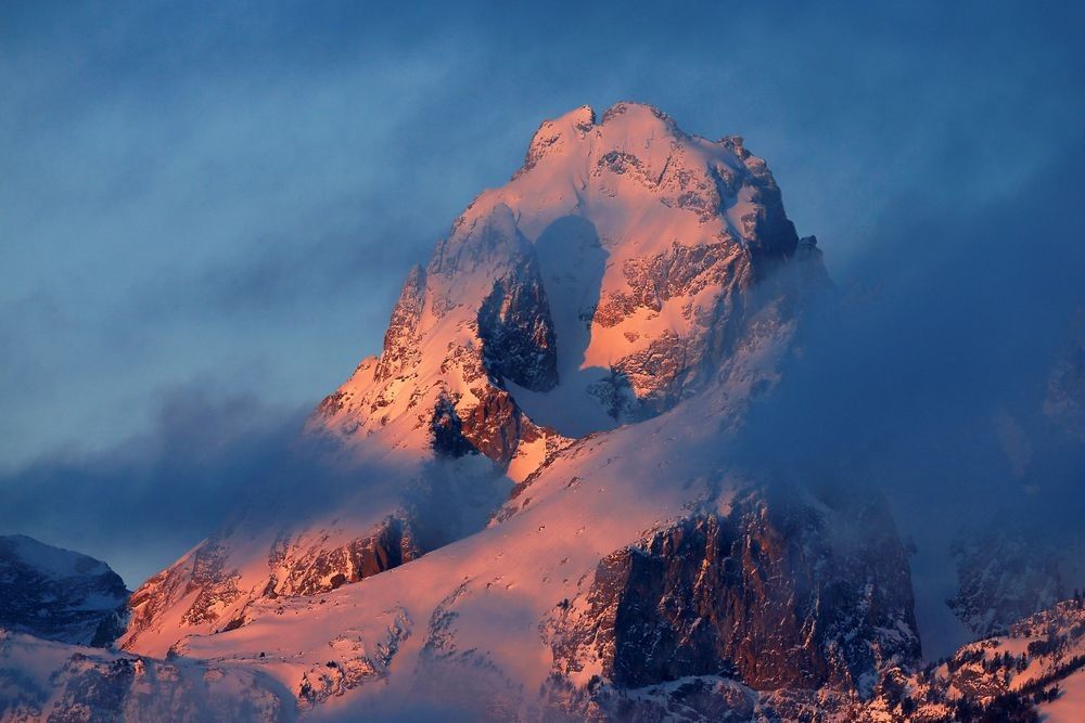 Grand Teton National Park mountain landscape with snow-covered peaks, valley light, and Wyoming alpine habitat photographed by Robbie George