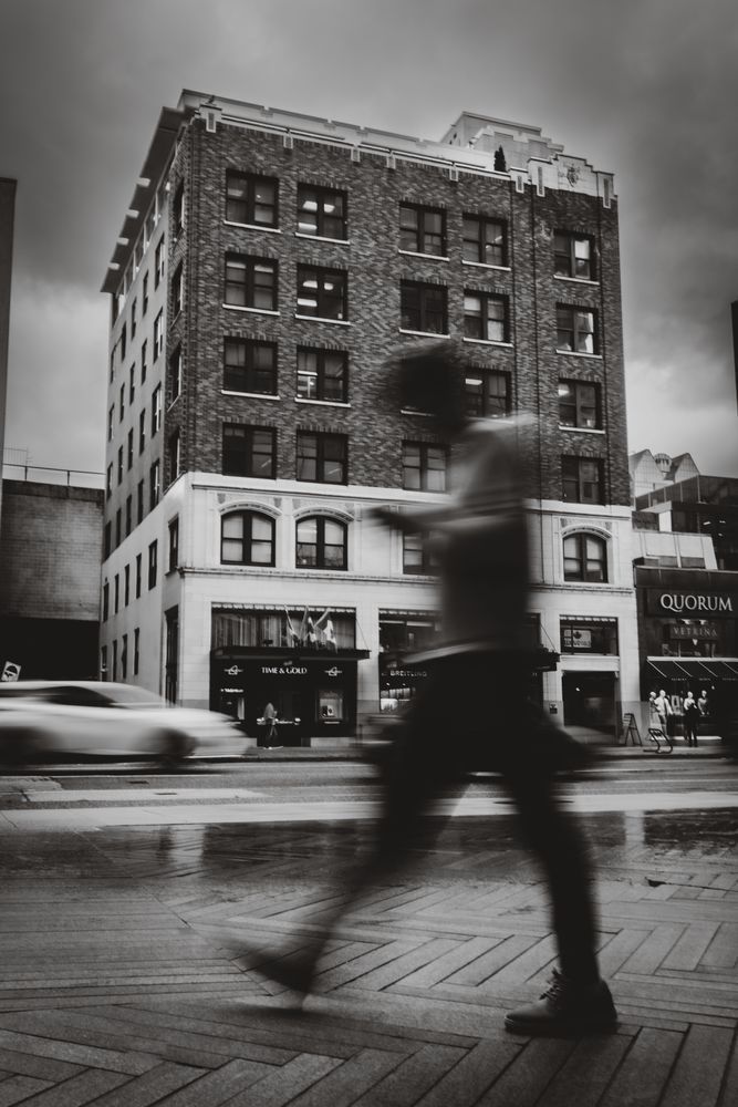 Urban Movement Meets Stillness – A Street Photography Reflection in Front of "Time & Gold", Vancouver