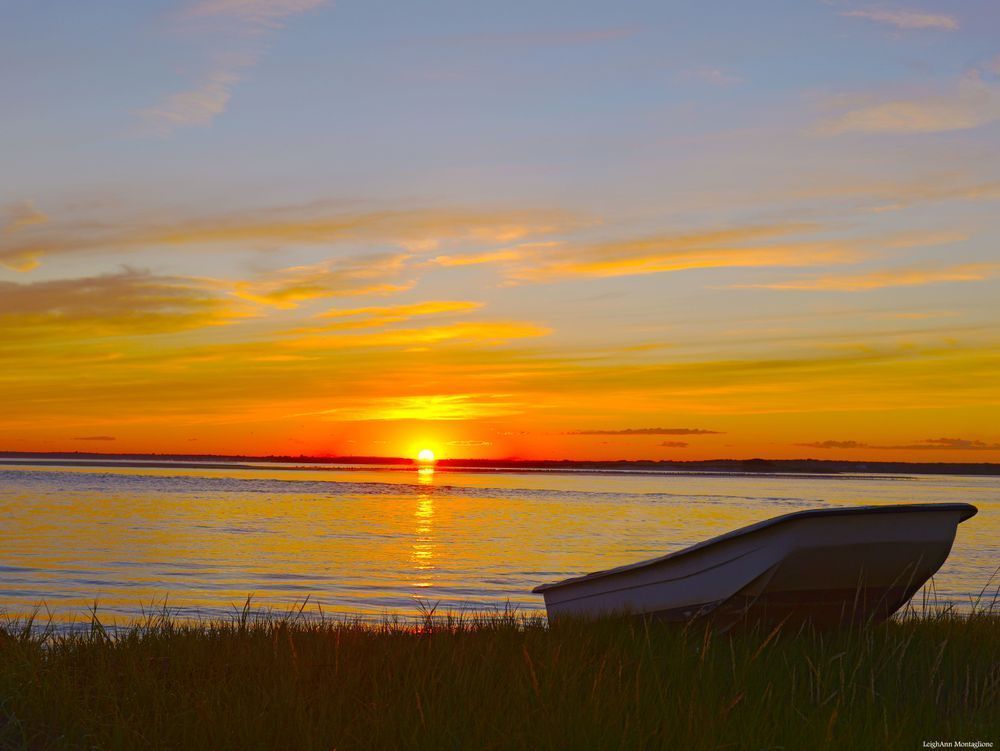 Sitting by the Boat at Sunset | Serene Coastal Wall Art