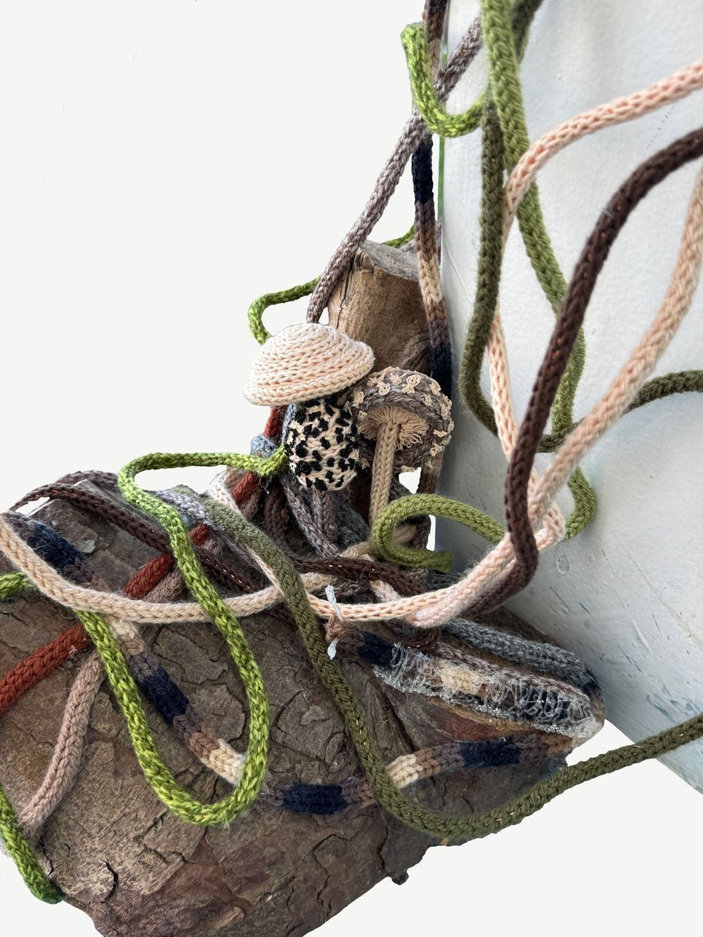 Knitted mushroom sculpture with thread network and natural wood forms by Scottish artist Gordon 'Griff' Griffiths
