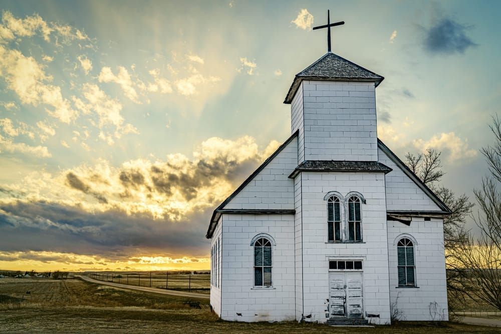 white church at sunset