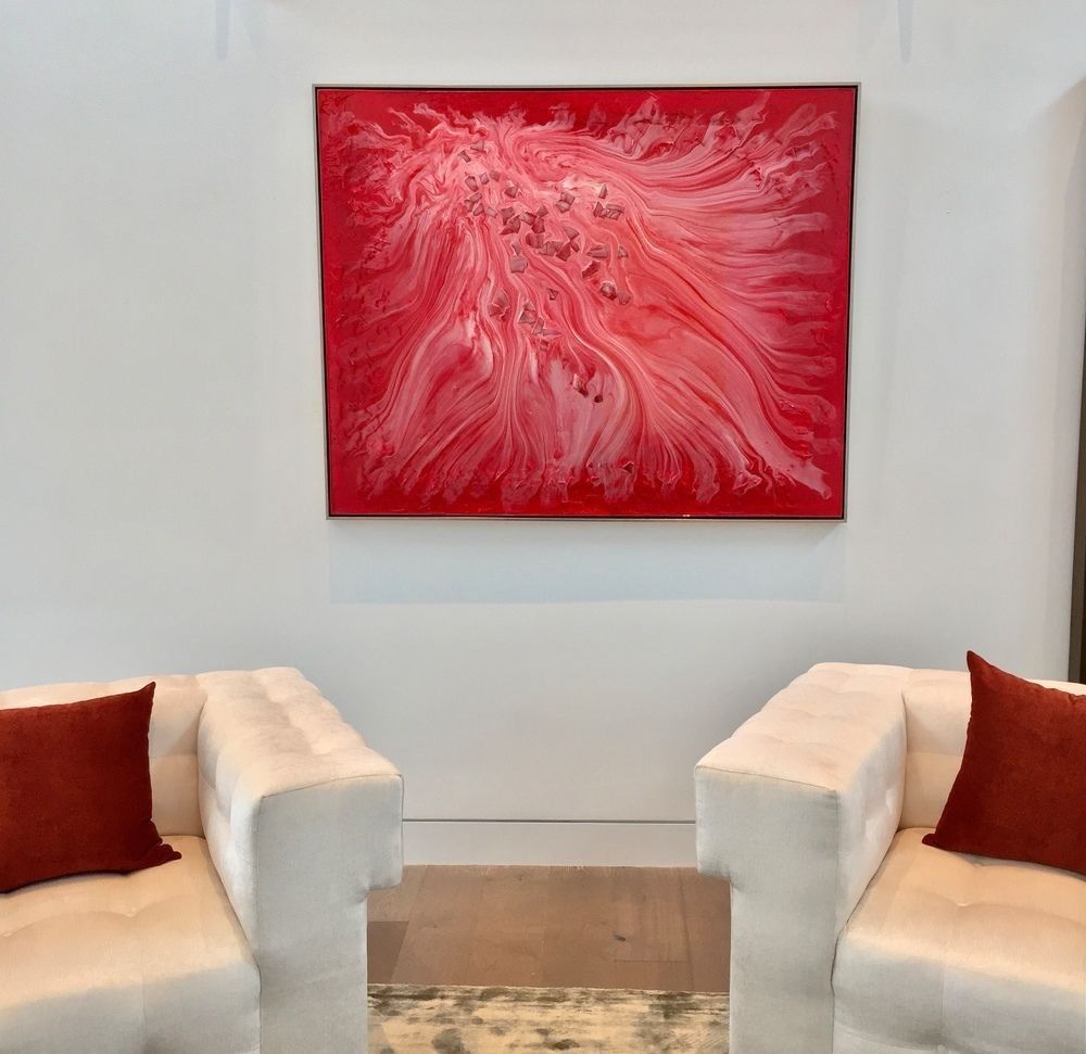 Wide horizontal abstract painting above a dining area