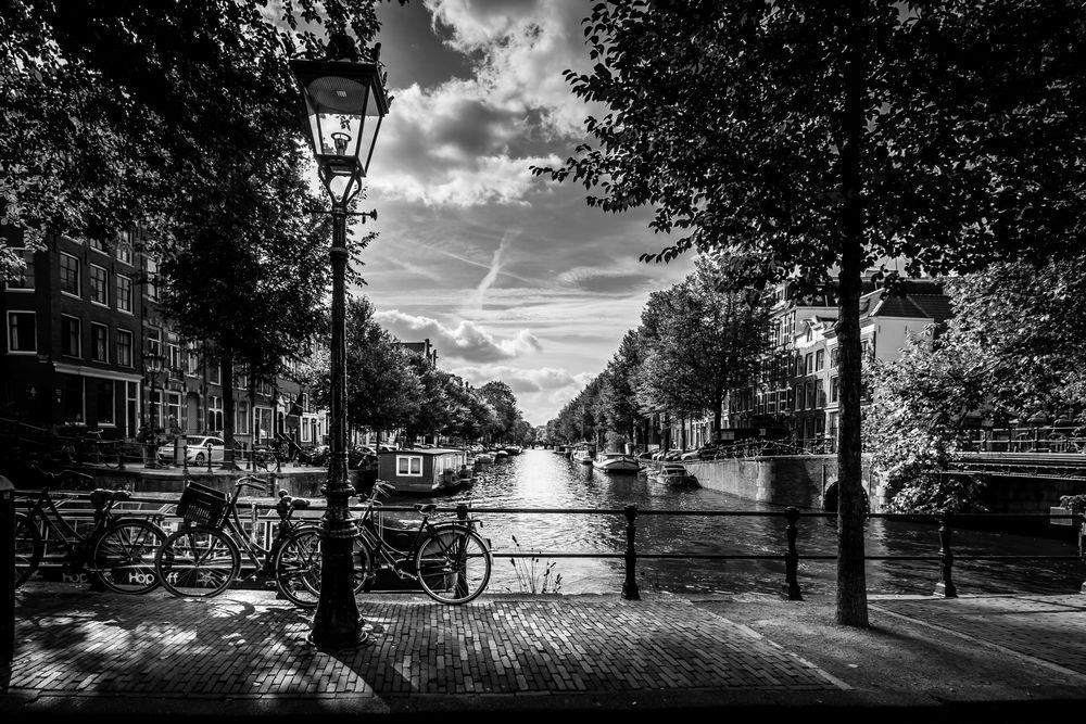 Canal Bridge Amsterdam with Bike and Street Light in Black and White