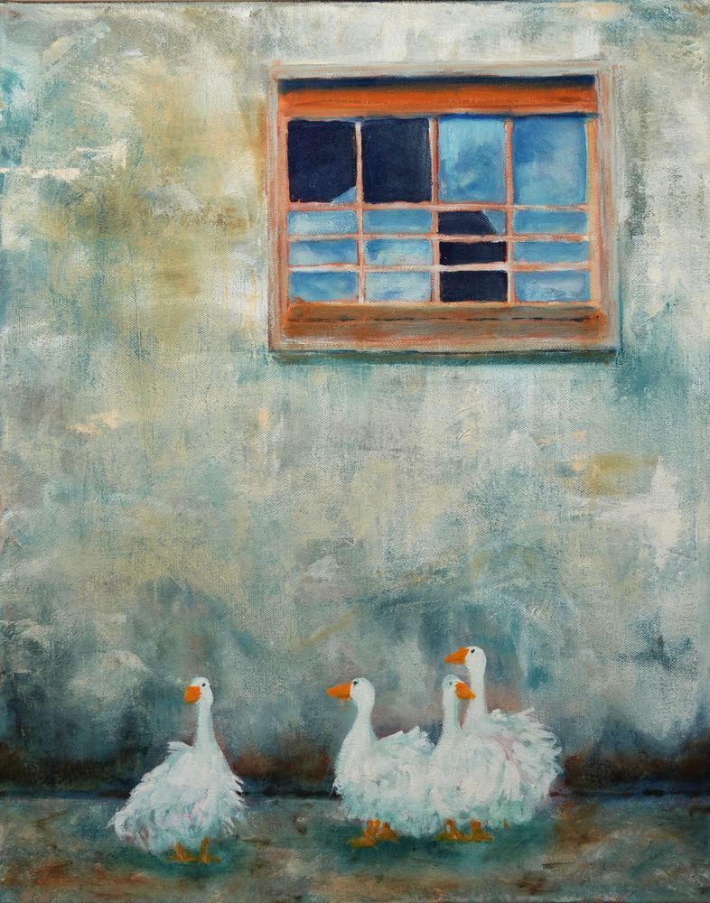 Four geese strut past a barn at the Land Based Learning Center in Yolo County, California.