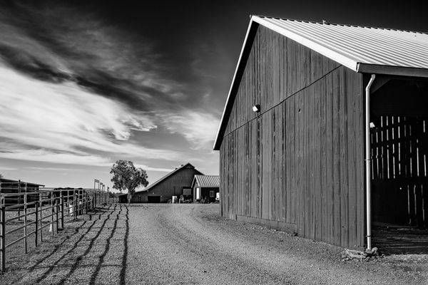 Clouds burn across the deep summer sky over a ranch in Yolo County, Northern California.
