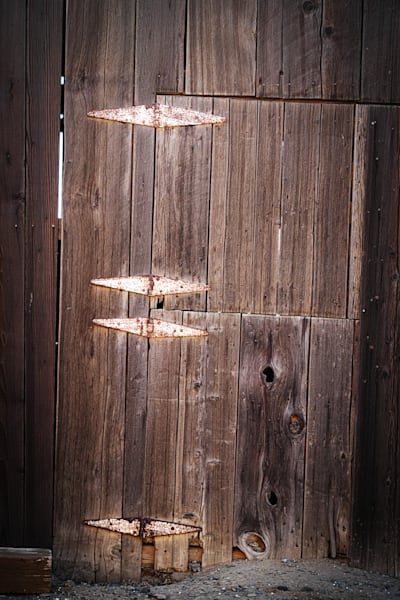 Rusting hinges still hold together a weather-beaten door to a barn on the Rodegerdt family ranch.