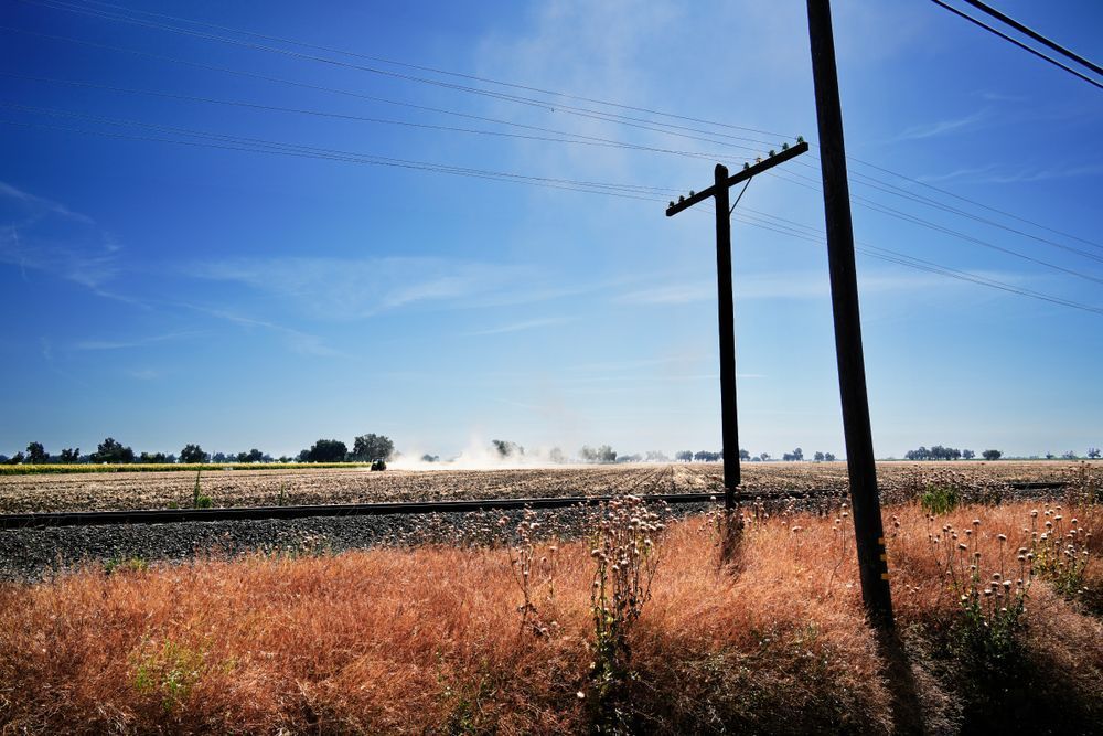 Dust blooms from the tilling of a family farm field in Yolo County, California.