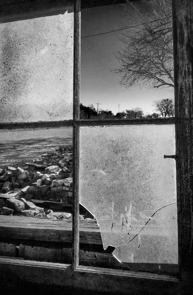 Morning light enters a broken window at Rominger Brothers Farm, in Yolo County, California.