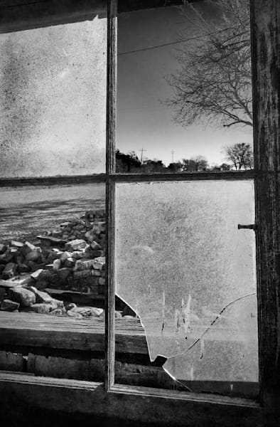 Morning light enters a broken window at Rominger Brothers Farm, in Yolo County, California.