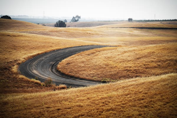 A curve in the access road carves into the late summer hillsides at Zamora Hills Ranch.