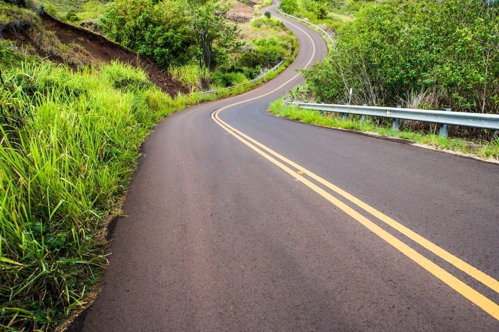 Winding highway 550 on the way up to Waimea Canyon just North of Waimea, Kauai, Hawaii, USA.