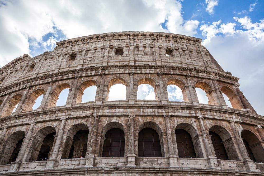 An exterior shot of part of the Colosseum in Rome, Italy.