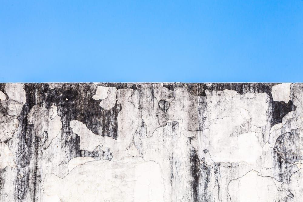 Weathered walls and hazy blue sky. Agra Fort, Agra, India.