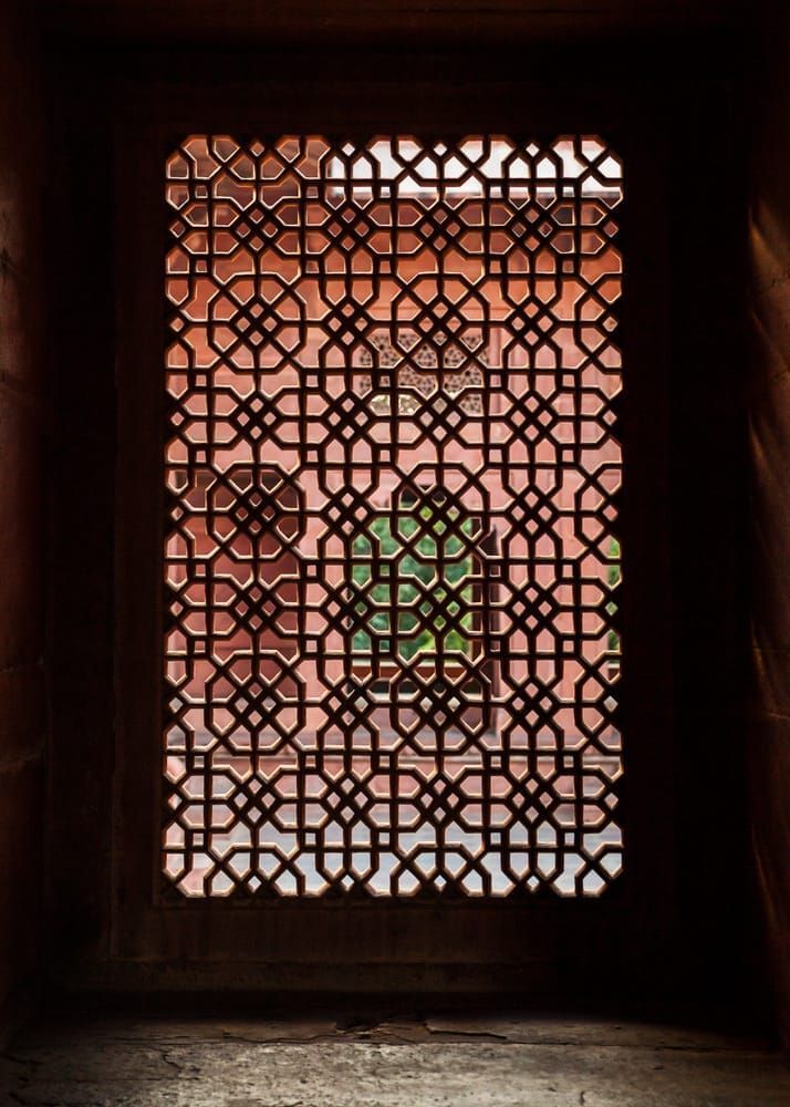 A ornate stone carved screen carved from a single piece of stone. Fatehpur Sikri complex, Uttar Pradesh India (near Agra).