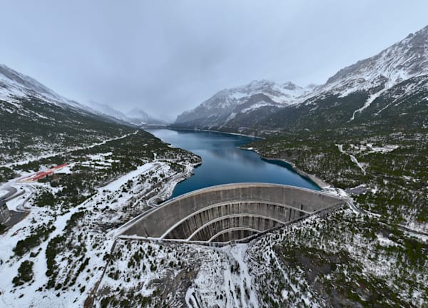 Lake Lago Cancano in Winter water retained by Dam - top view