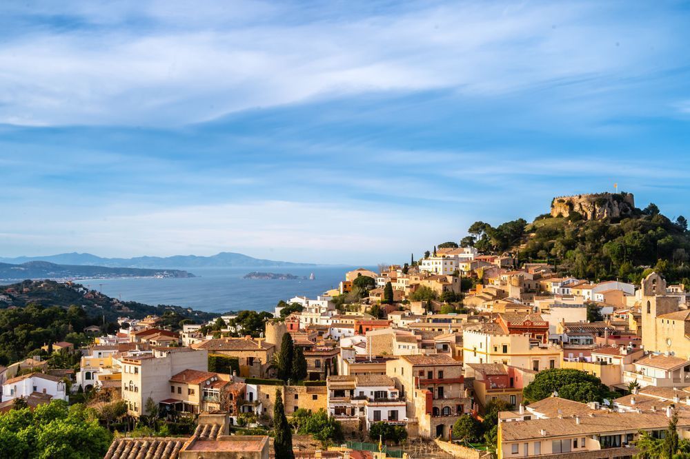 Castle Over the Coast - Costa Brava townscape with historic castle and coastal light