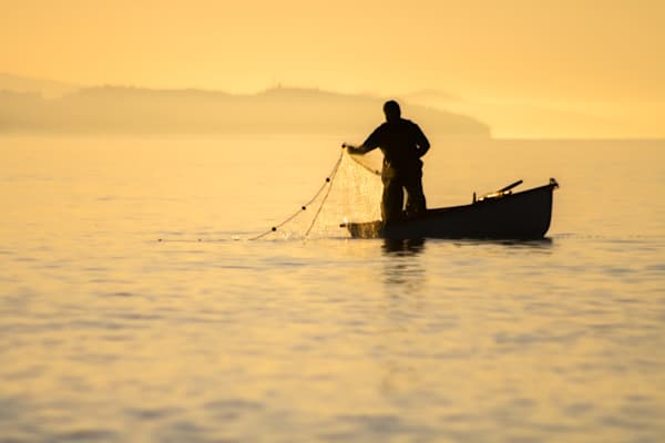 Catching the Goldfish - Seaside image showing traditional fishing at golden hour