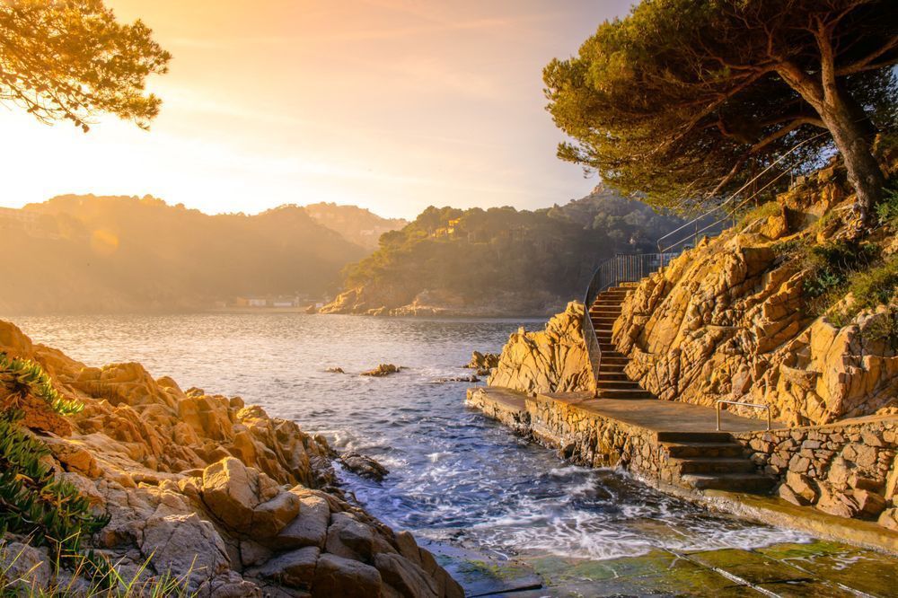 Golden Steps by the Sea - Scenic coastal path captured in soft evening light
