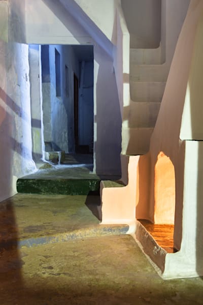Hot and Cold - Award-winning fine art photograph of an abandoned interior with firelight